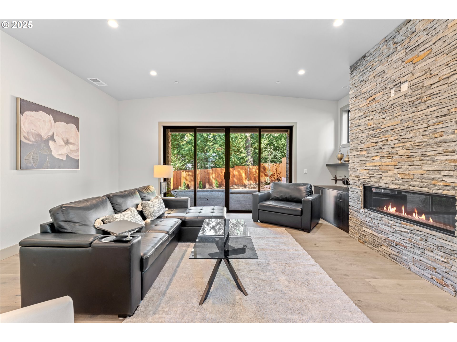 15003 Twin Fir Road Lake Oswego, OR 97035 - Photo 15 of 42 a living room with furniture and a fireplace