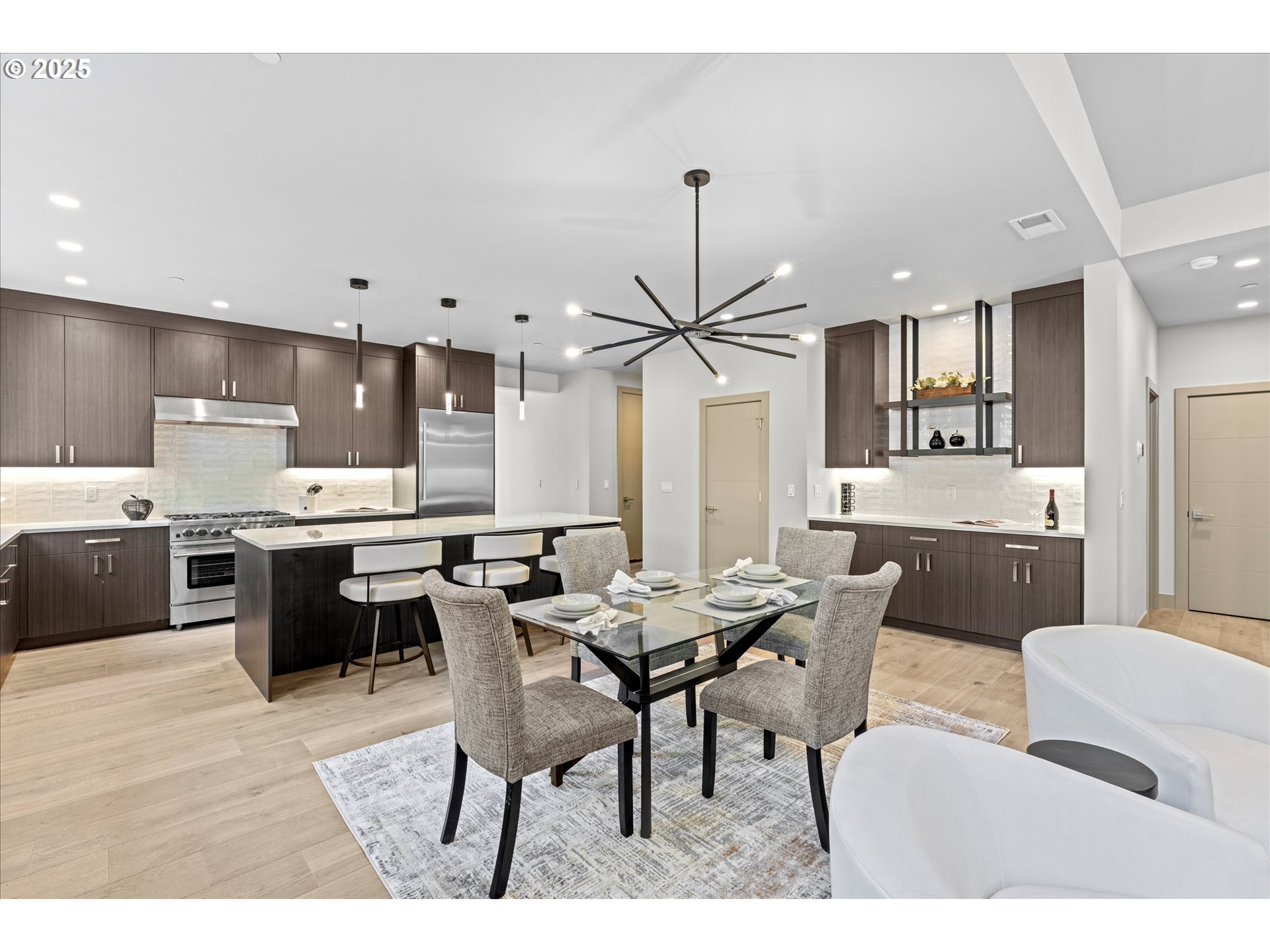 15003 Twin Fir Road Lake Oswego, OR 97035 - Photo 18 of 42 a kitchen with a table chairs microwave and cabinets
