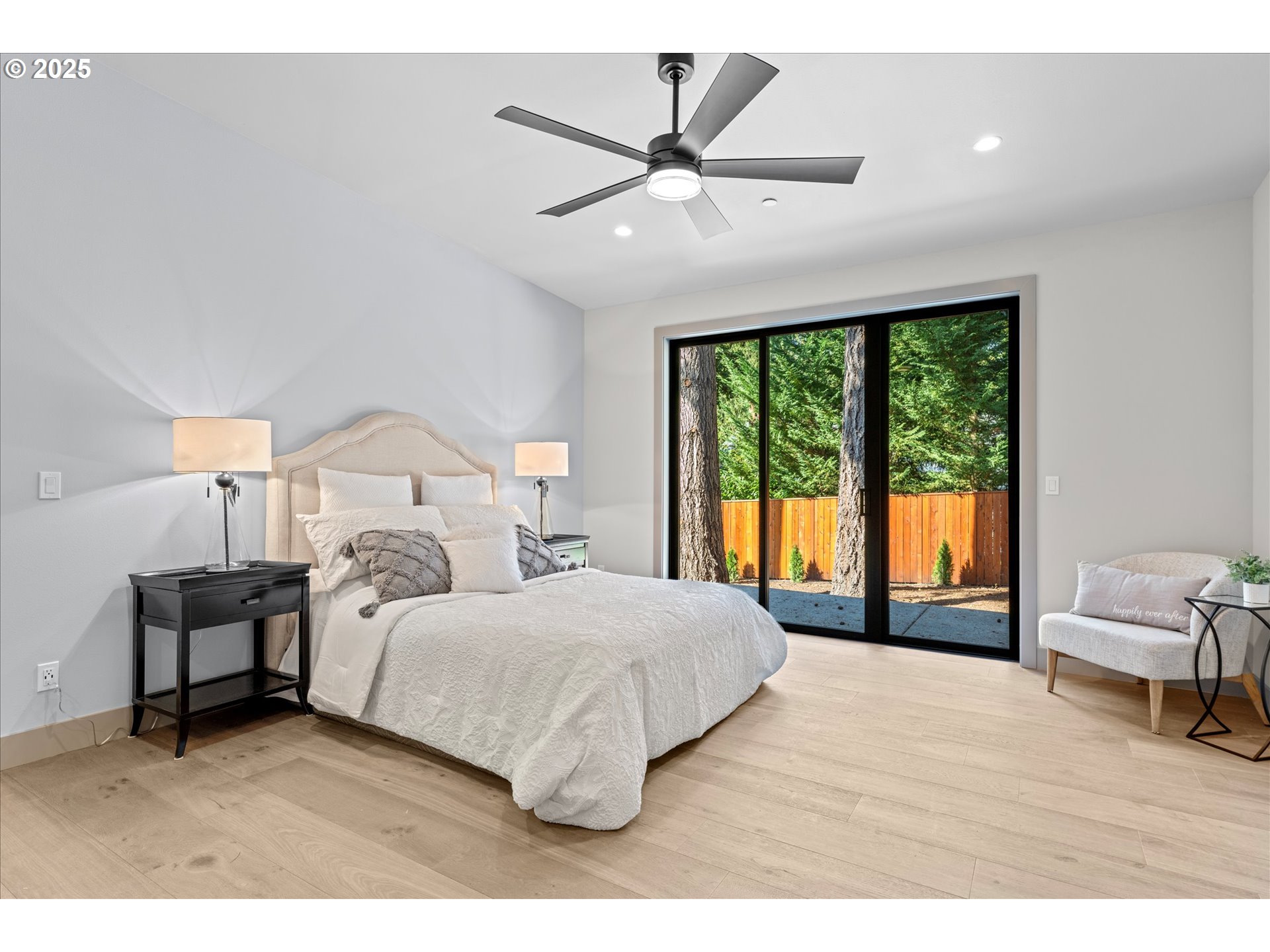 15003 Twin Fir Road Lake Oswego, OR 97035 - Photo 20 of 42 a bedroom with a large bed and a large window