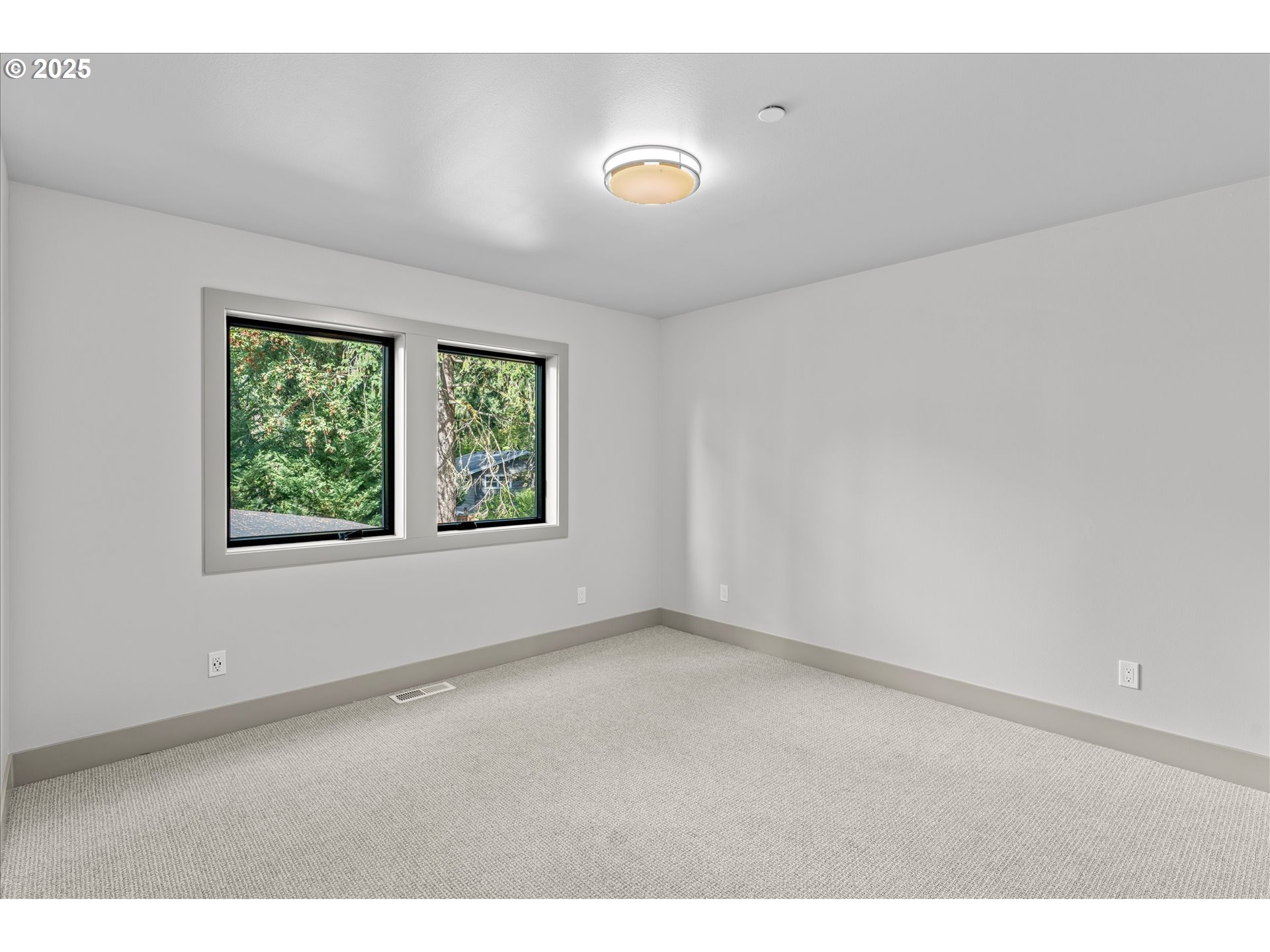 15003 Twin Fir Road Lake Oswego, OR 97035 - Photo 30 of 42 a view of an empty room with a window