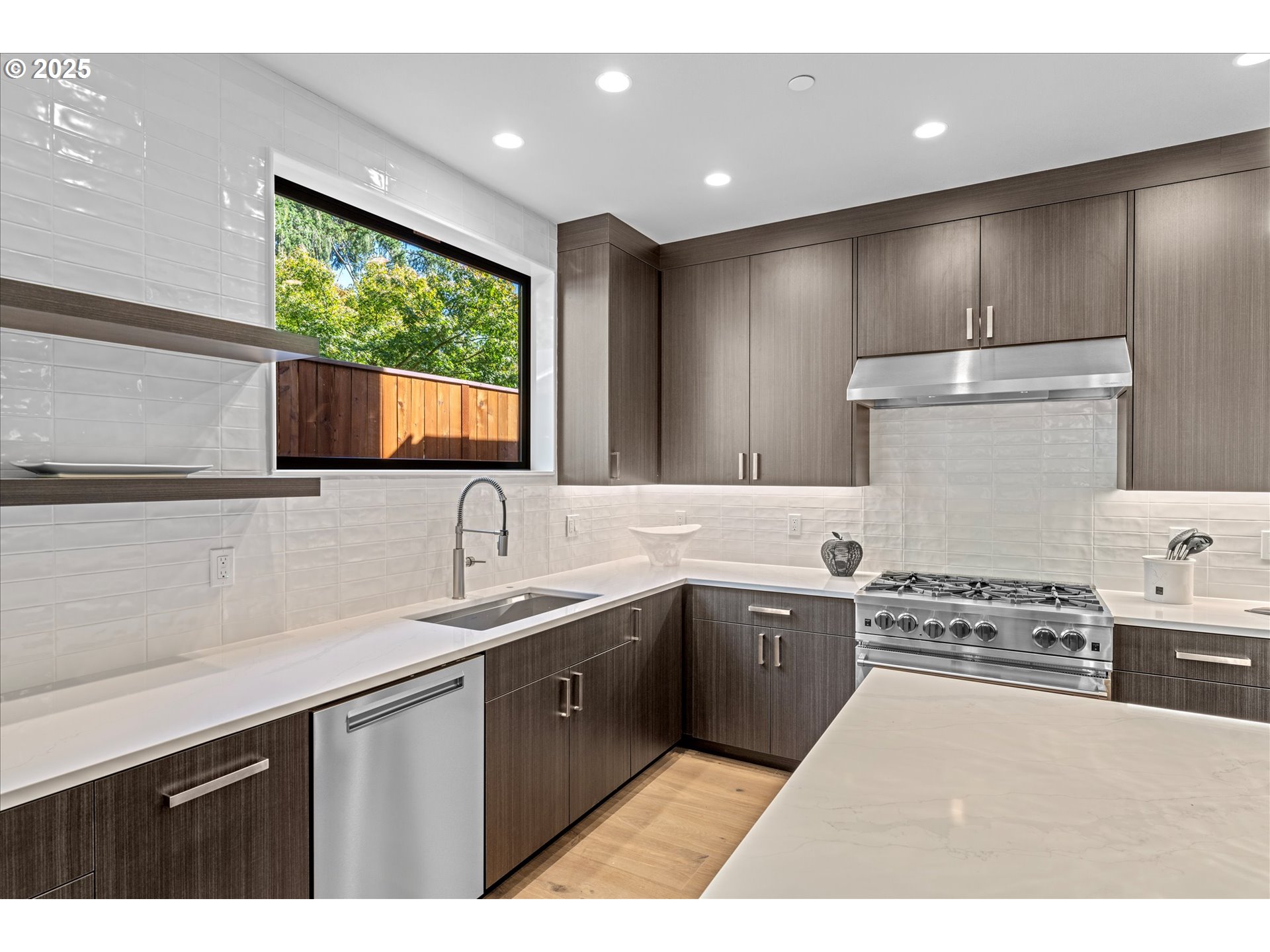 15003 Twin Fir Road Lake Oswego, OR 97035 - Photo 9 of 42 a kitchen with a sink stove and cabinets