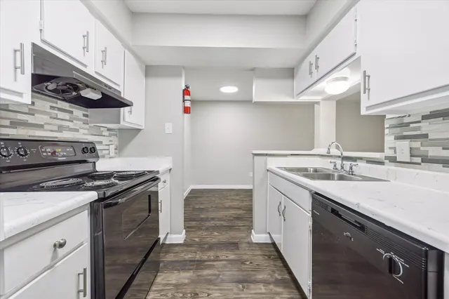 a kitchen with a stove and a sink