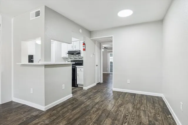 a view of kitchen with wooden floor