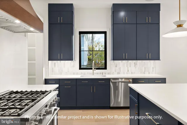 a kitchen with a sink and a stove