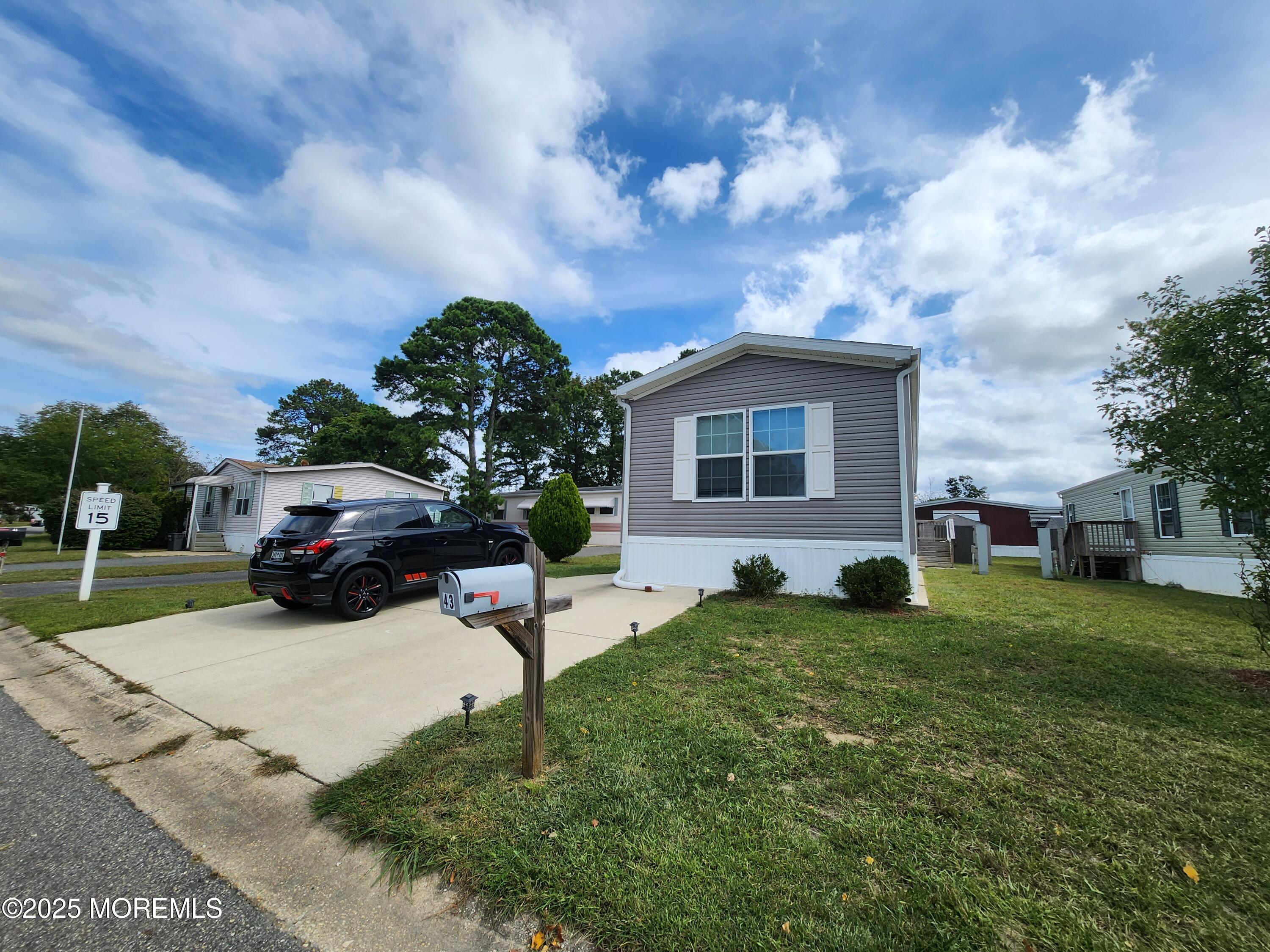 a view of a house with a yard
