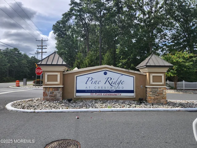 a view of a street with a sign board