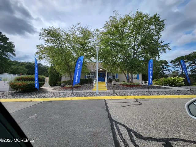 a room with pool table and windows