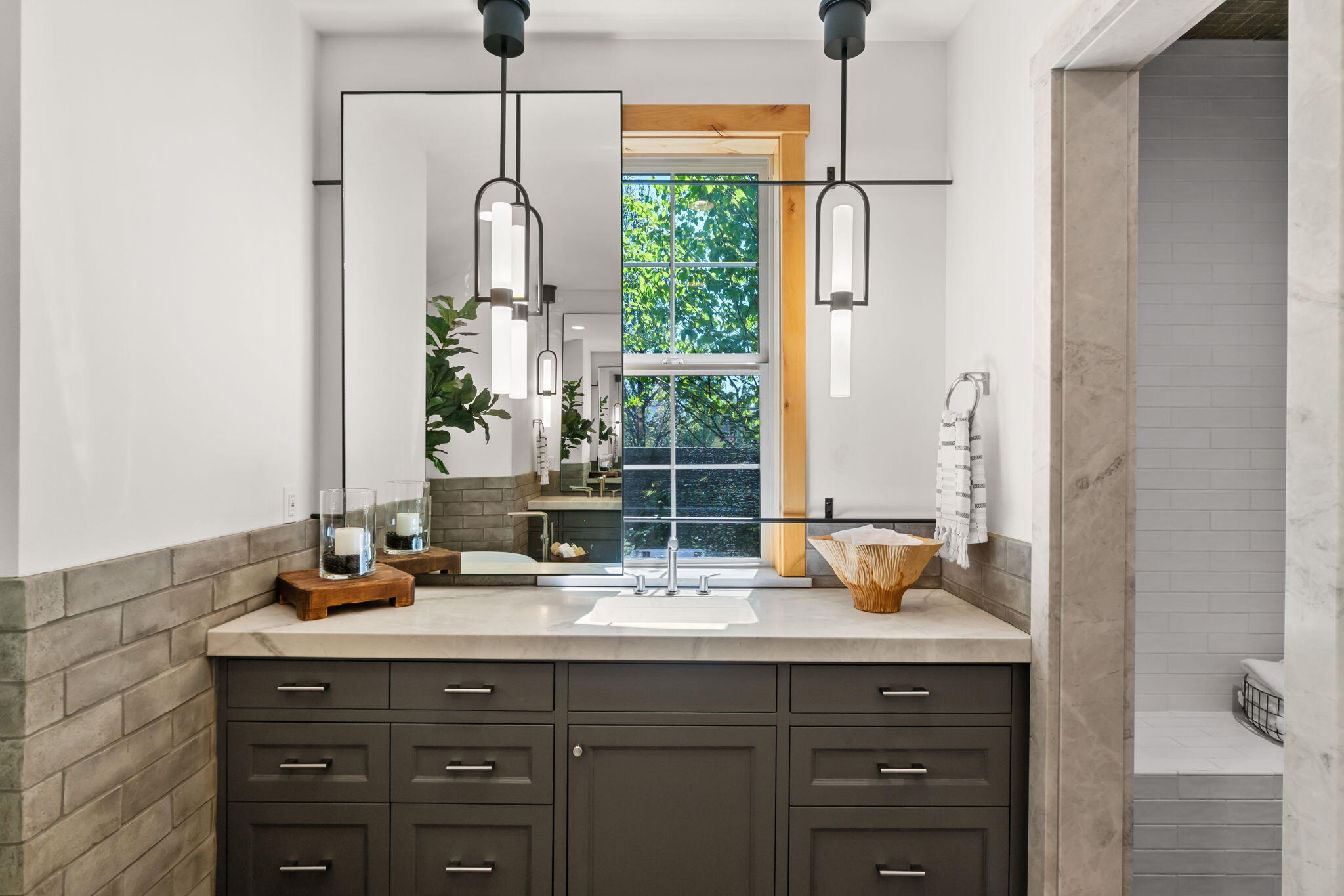 655 Southwest Otter Way Bend, OR 97702 - Photo 22 of 49 Separate vanities with honed Quartzite slab and mitered edge.