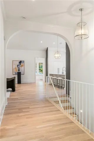 a view of a room with wooden floor and stairs