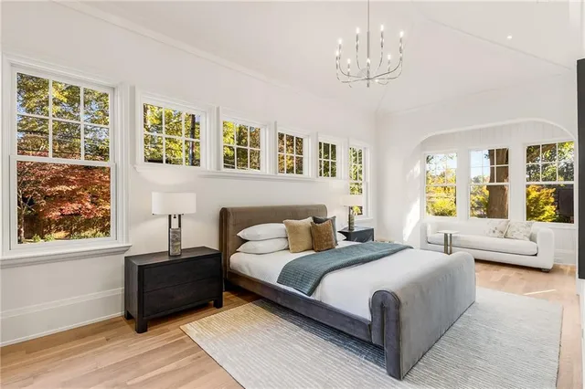 a bedroom with a large bed and a couch