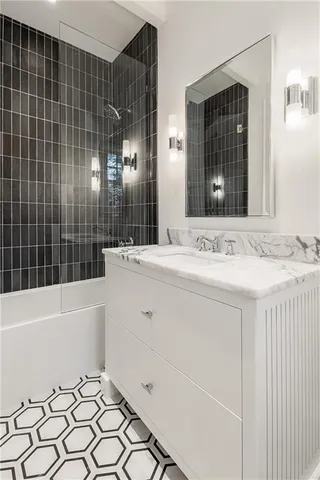 a bathroom with a bathtub and a sink