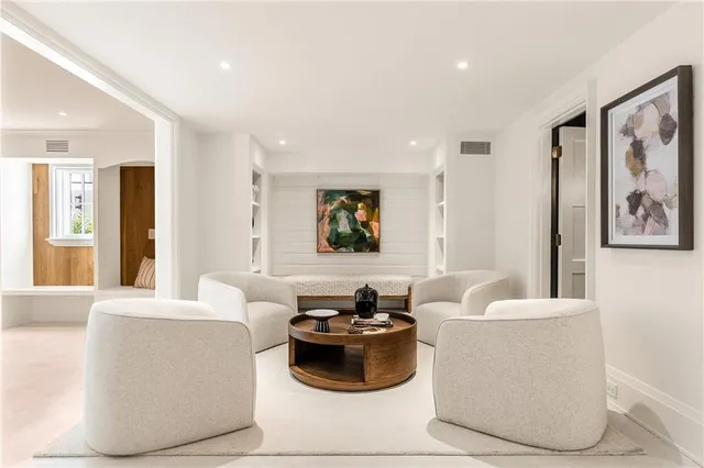 a living room with furniture and a couch