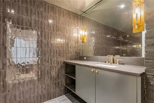 a bathroom with a double vanity sink and mirror