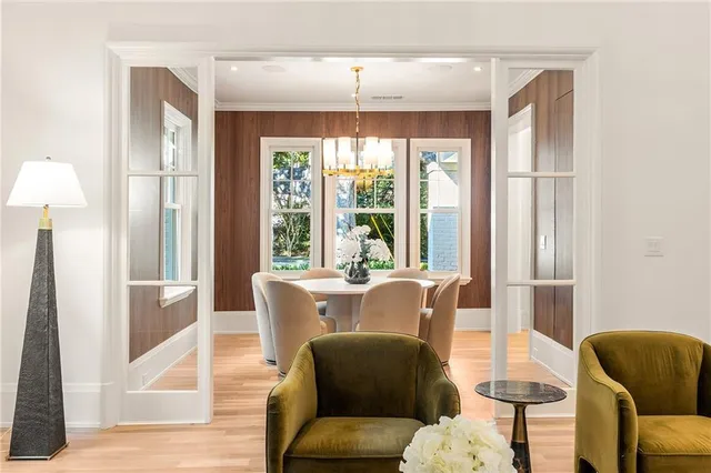 a dining room with furniture and wooden floor