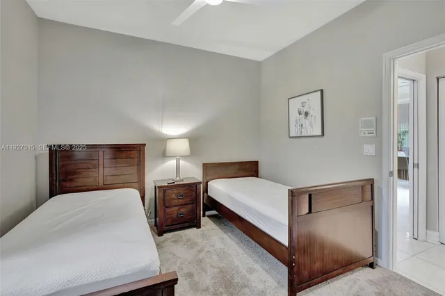 a bedroom with a bed and a chair