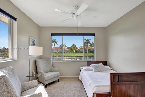 a bedroom with a large bed and a view of bedroom
