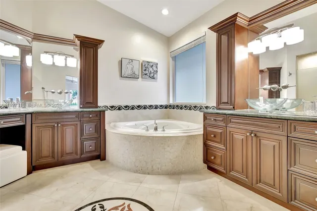 a swimming pool with outdoor seating yard and glass windows