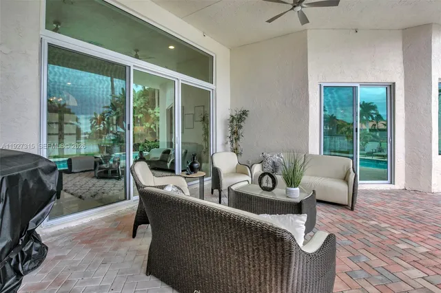 a view of a backyard with a garden and palm trees