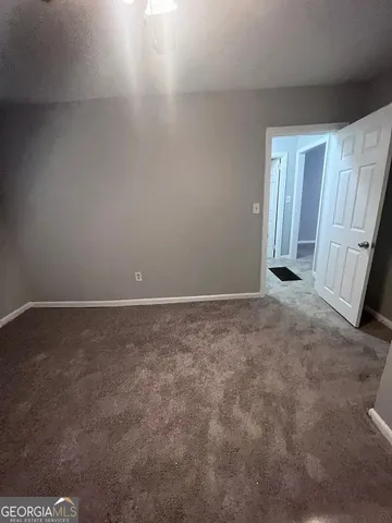 a kitchen with a stove and white cabinets