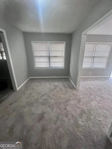 an empty room with windows