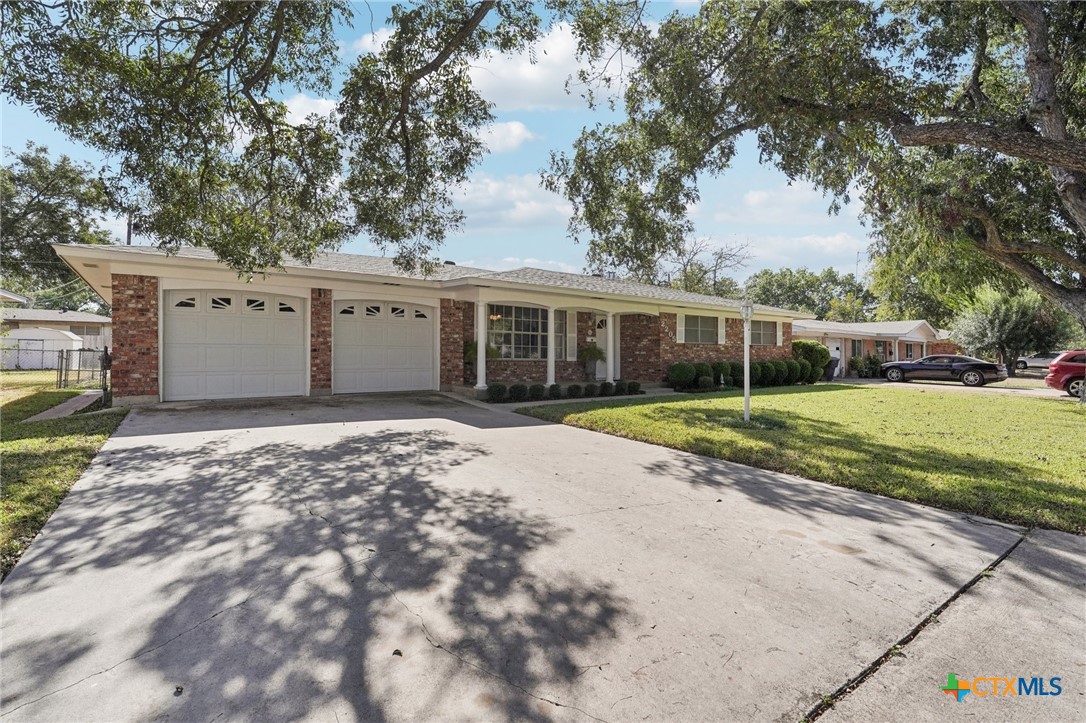 2205 South 53rd Street Temple, TX 76504 - Photo 3 of 44 a view of house with backyard and tree