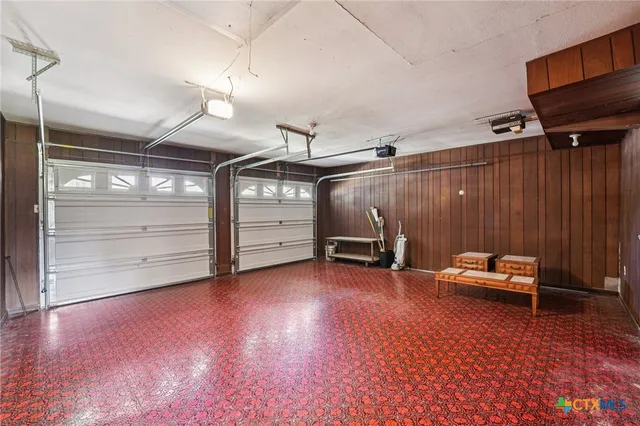 a view of a house with backyard and porch
