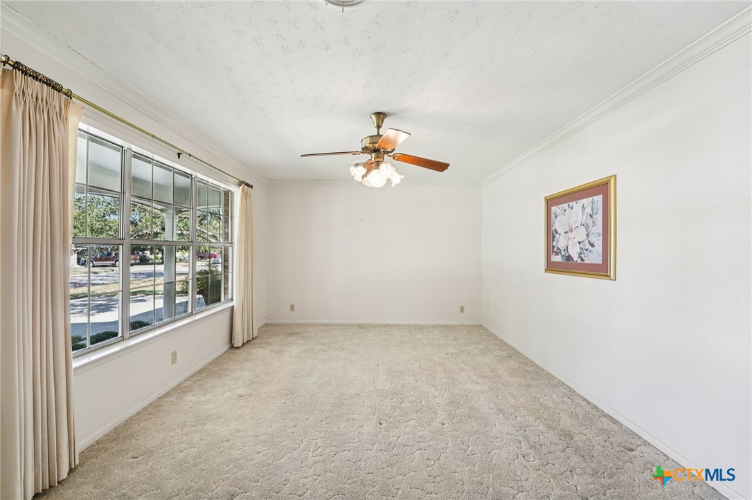 2205 South 53rd Street Temple, TX 76504 - Photo 10 of 44 wooden floor in an empty room with a window