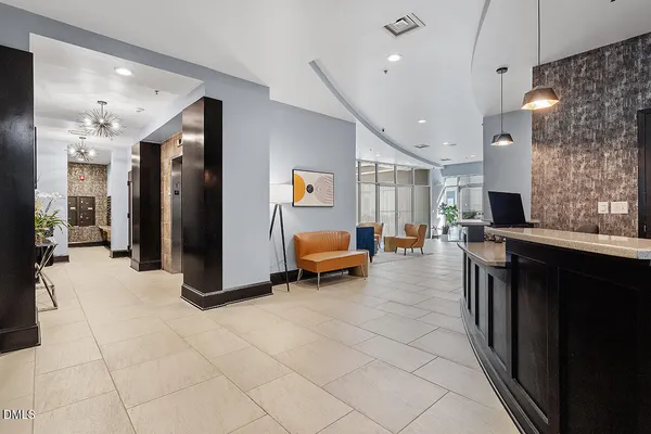 a lobby with furniture and a large window