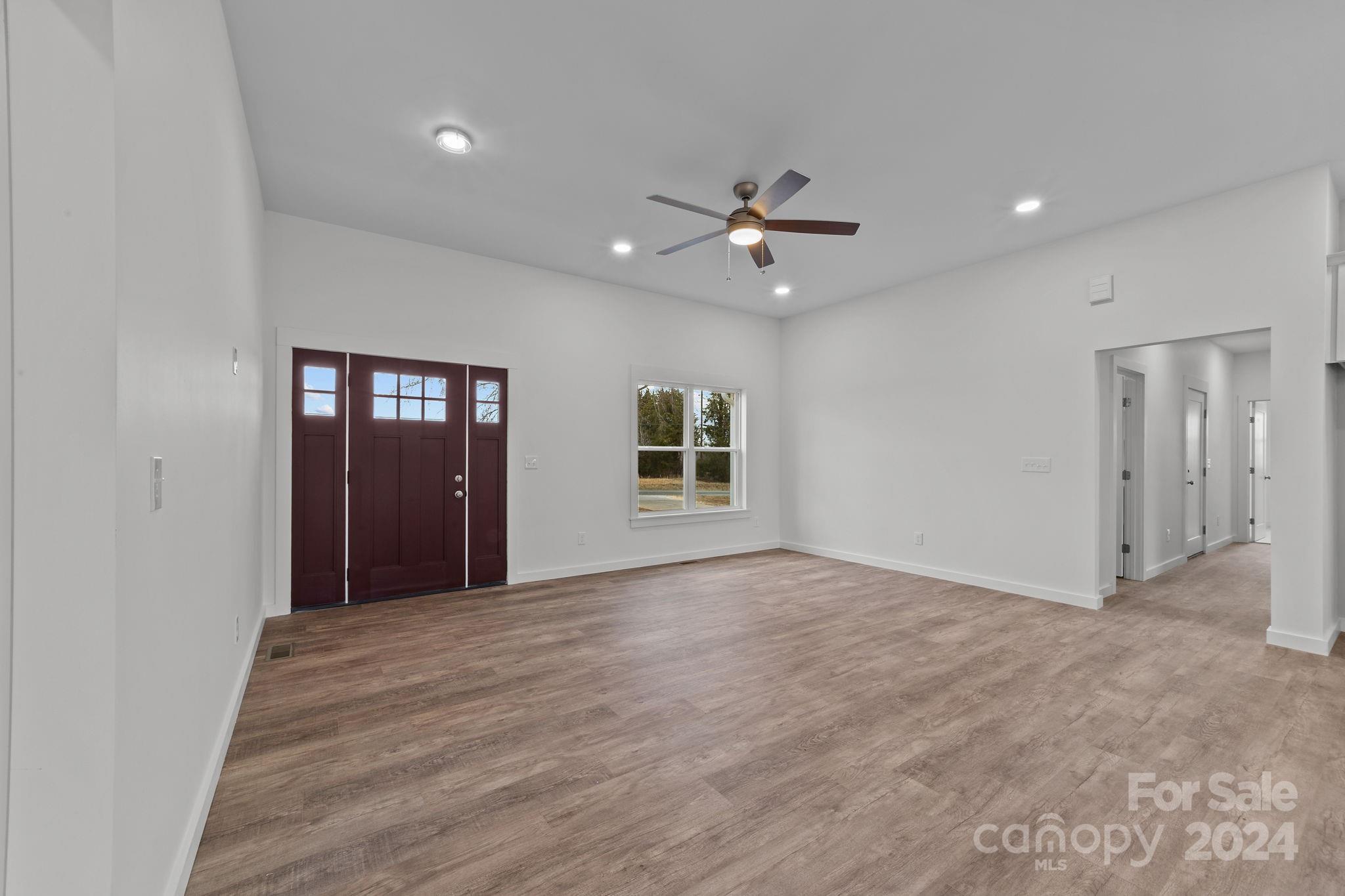 220 Linker Road Rockwell, NC 28138 - Photo 11 of 48 a view of an empty room with window and cabinet