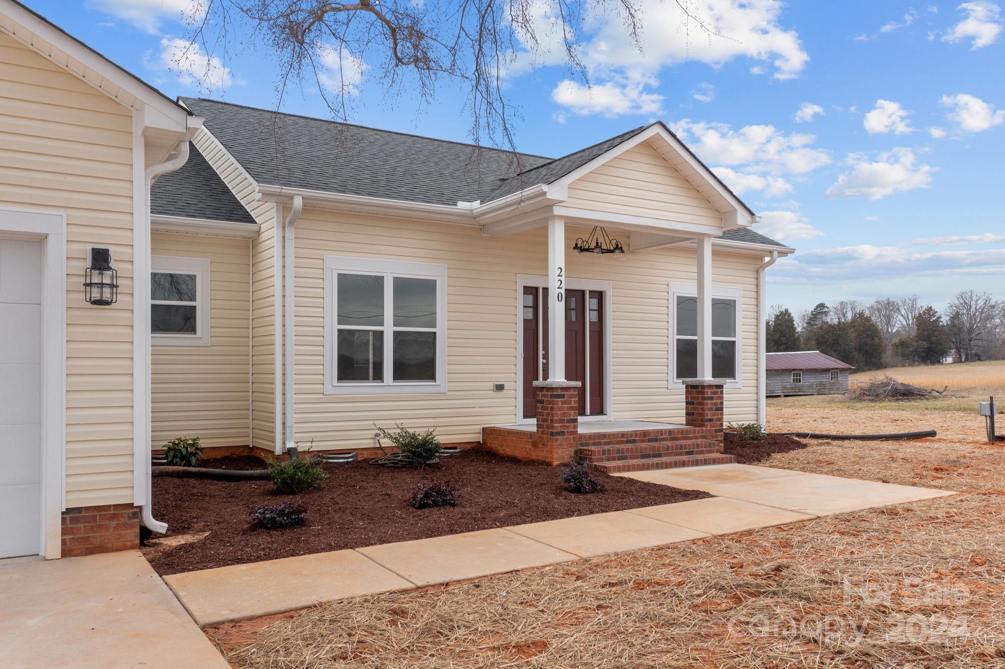 220 Linker Road Rockwell, NC 28138 - Photo 5 of 48 a front view of a house with a yard