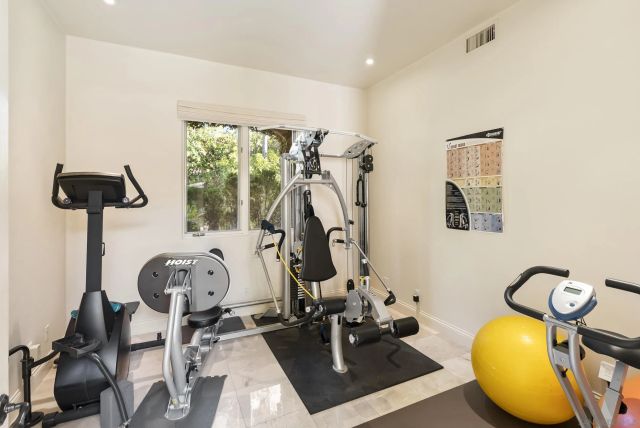 a utility room with sink dryer and washer
