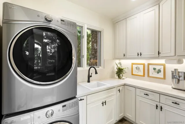 an aerial view of a house with a yard and garden