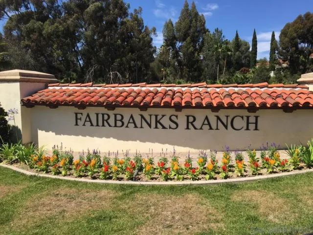 a view of a lake with houses in the back