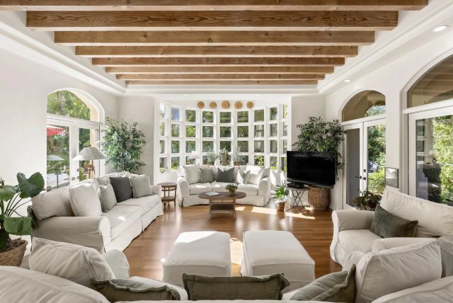 a large kitchen with a table and chairs