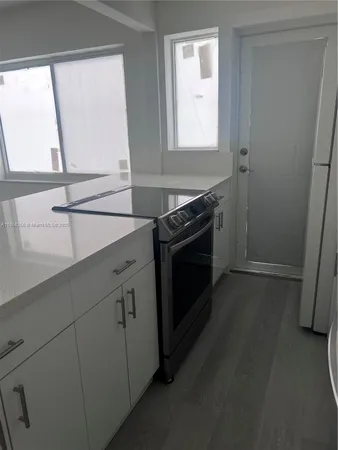 a kitchen with a stove and a sink