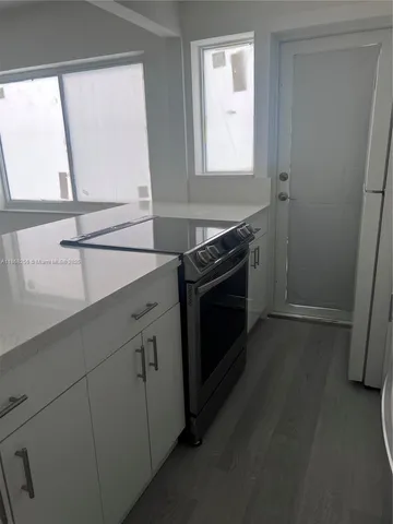 a kitchen with a stove and a sink