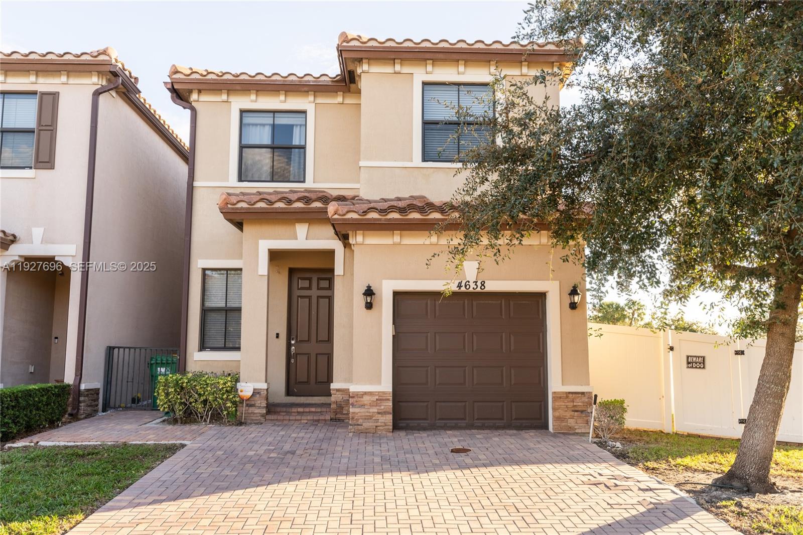 4638 Northwest 59th Street Tamarac, FL 33319 - Photo 1 of 34 a front view of a house with garden