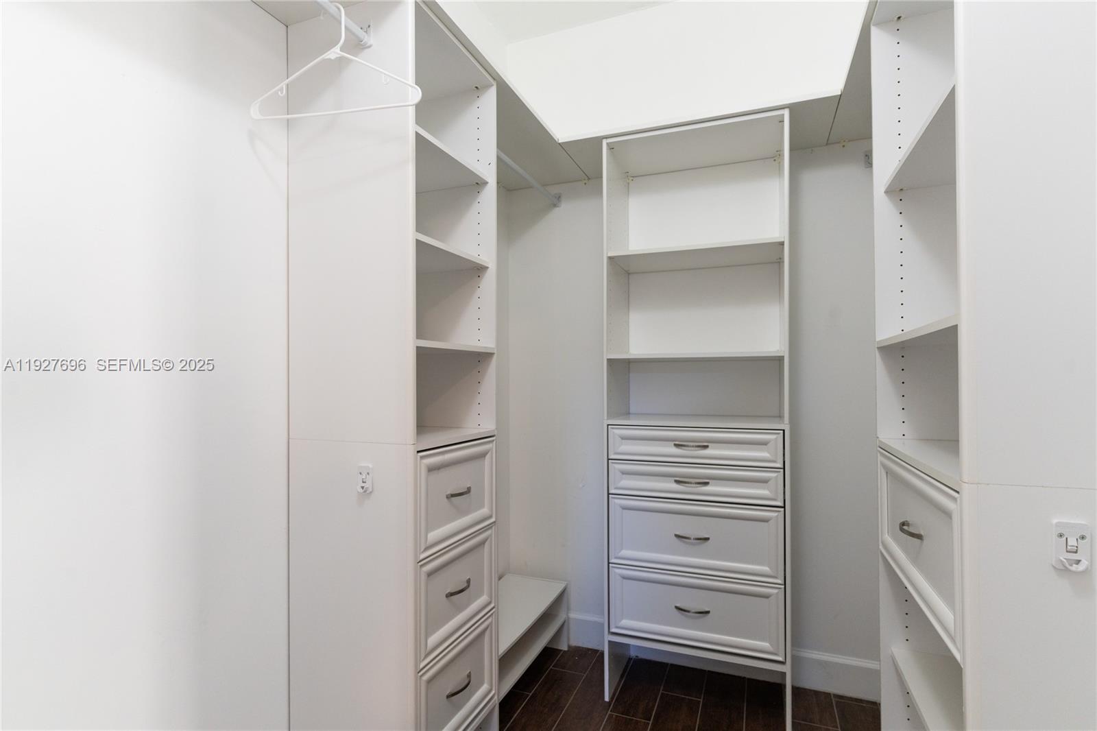 4638 Northwest 59th Street Tamarac, FL 33319 - Photo 18 of 34 a view of walk in closet with empty racks