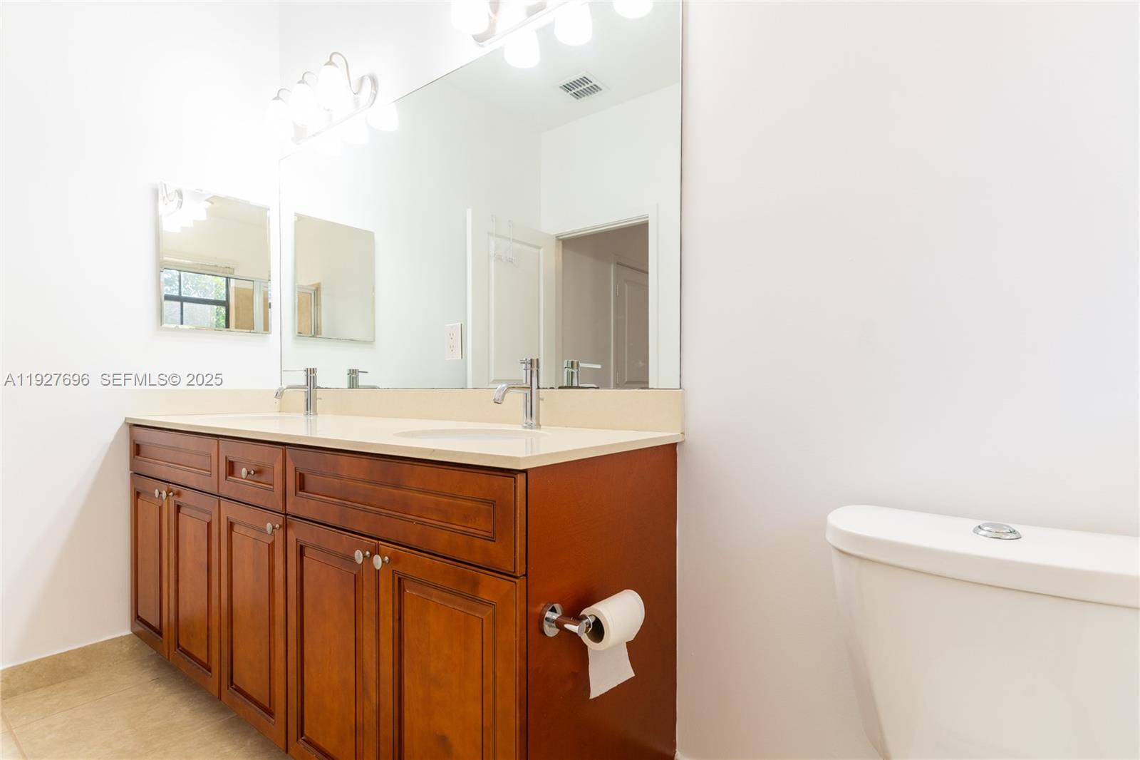 4638 Northwest 59th Street Tamarac, FL 33319 - Photo 26 of 34 a bathroom with a sink and a toilet