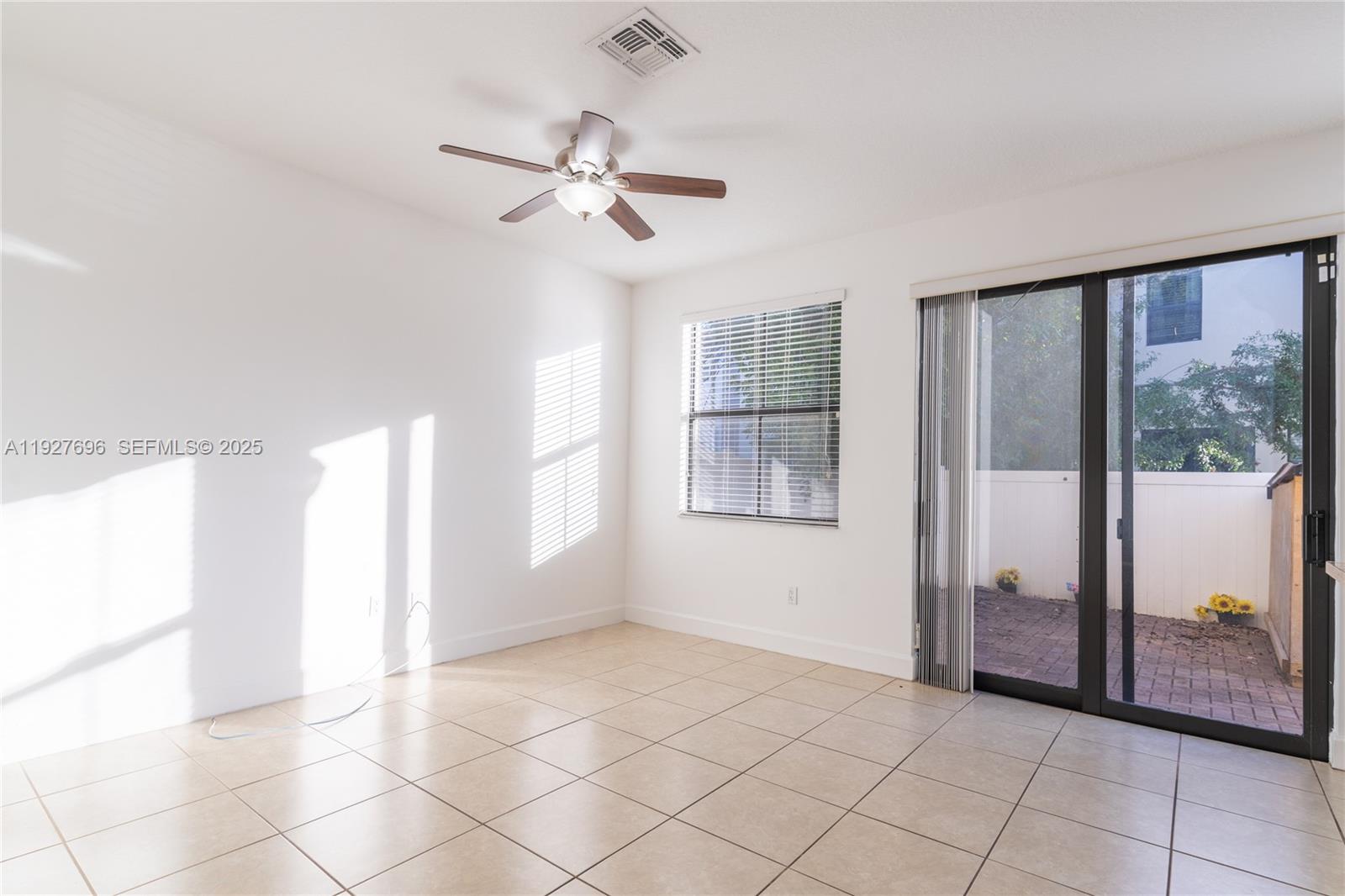 4638 Northwest 59th Street Tamarac, FL 33319 - Photo 6 of 34 a view of an empty room with window