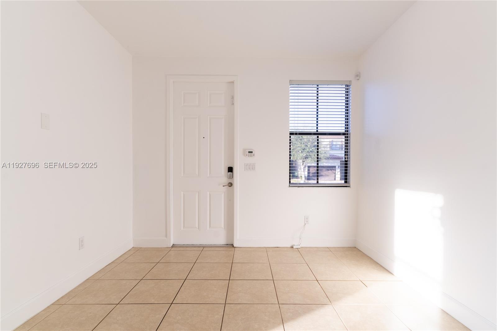 4638 Northwest 59th Street Tamarac, FL 33319 - Photo 8 of 34 a view of an empty room with window