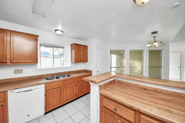 a view of a kitchen counter space and windows