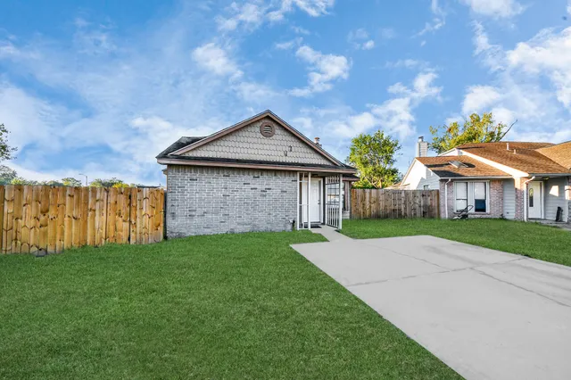 a front view of a house with yard