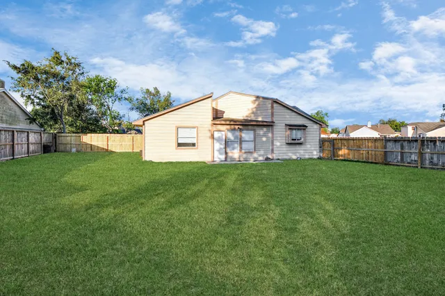a front view of house with garden