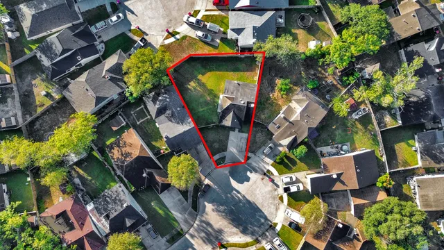 an aerial view of residential house with outdoor space and swimming pool