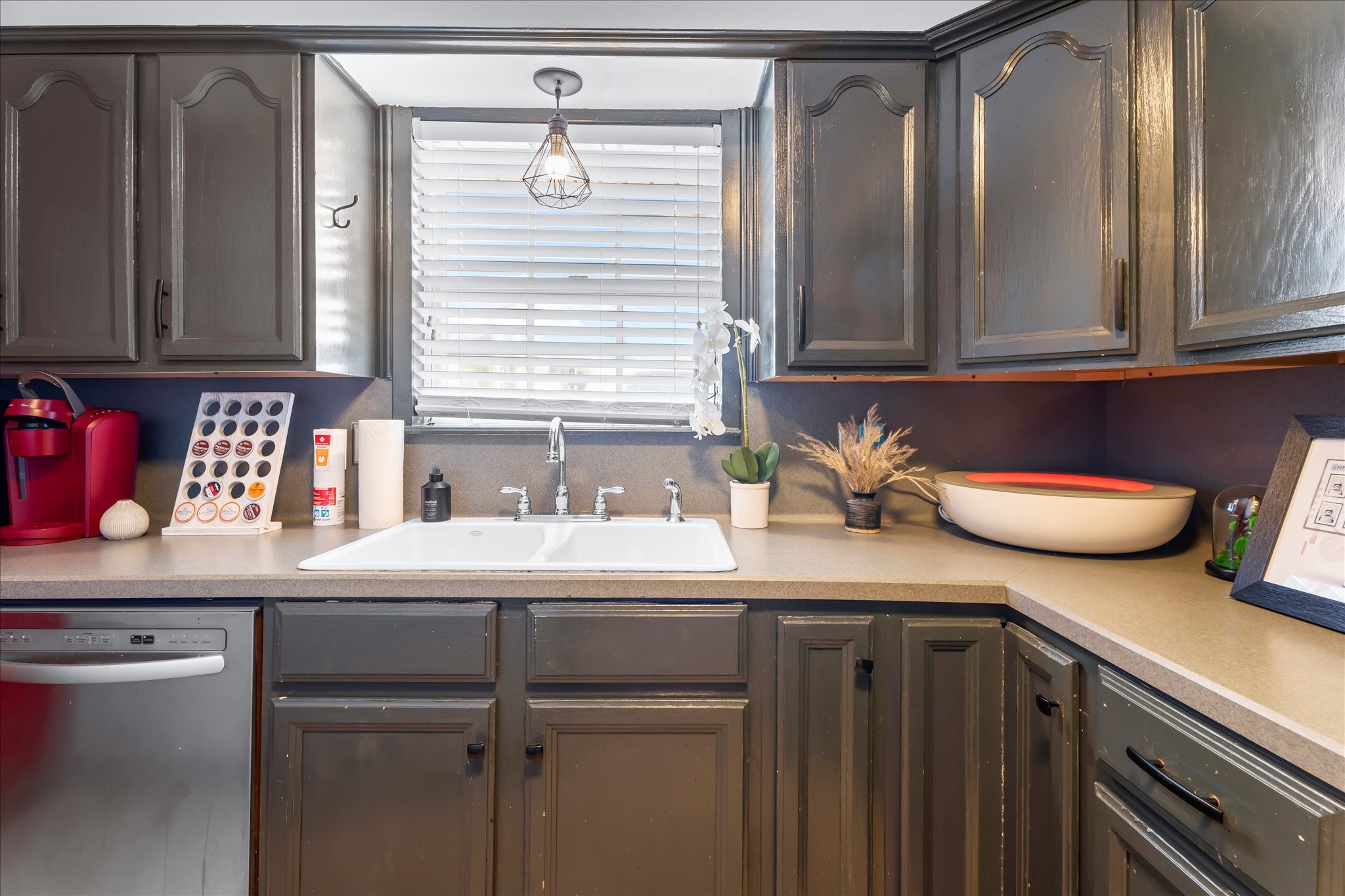 9902 Franklin Road Houston, TX 77070 - Photo 11 of 43 a kitchen with stainless steel appliances a sink and cabinets