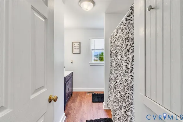 a white wall under an umbrella in a bathroom