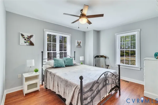 an aerial view of a house with a yard lake house and outdoor seating