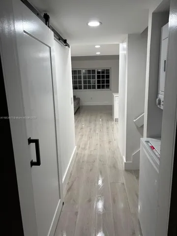 a kitchen with stainless steel appliances a microwave and cabinets
