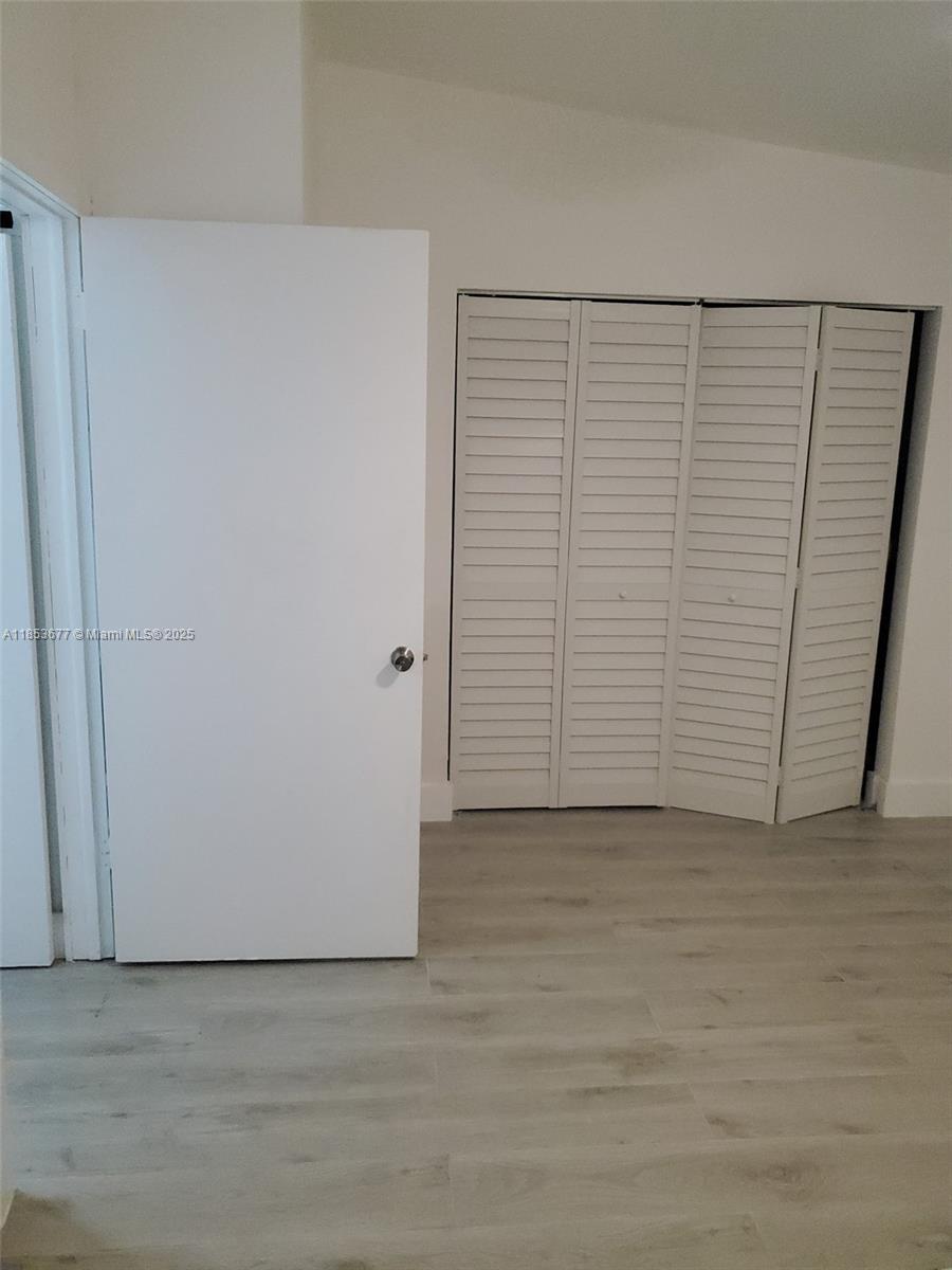6886 Northwest 166th Terrace, Unit 1004 Miami Lakes, FL 33014 - Photo 5 of 27 a view of an empty room